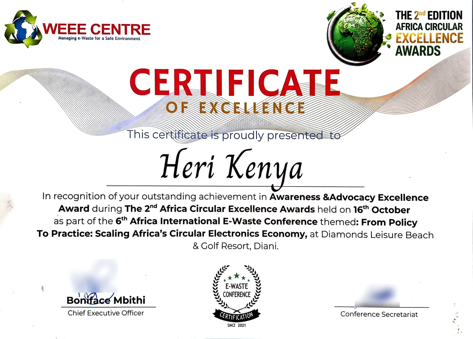 Certificate of Excellence from WEEE Centre presented to HERI-Kenya for the Awareness & Advocacy Excellence Award at the 2nd Africa Circular Excellence Awards